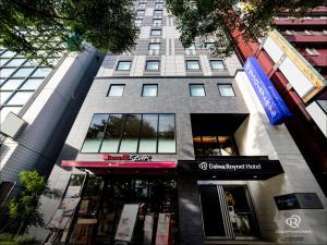 a tall building with a store in front of it at Daiwa Roynet Hotel Chiba Ekimae in Chiba