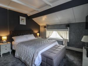 a bedroom with a large bed and a window at Rock Hollow in Halifax