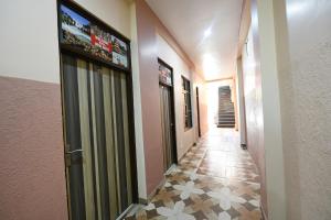 a hallway of a building with a tile floor at Via Galaxy in Chandīgarh