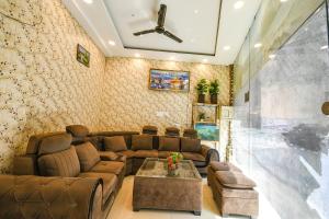 a living room with a couch and a table at Via Galaxy in Chandīgarh +19 photos