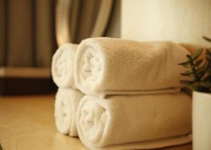 a pile of towels sitting on top of a table at Hotel DADA Insadong in Seoul