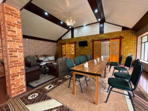a conference room with a table and chairs at Panjrud guest house in Panjakent