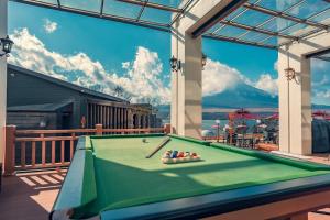 a pool table on a deck with a view of a mountain at Fuji Yamanakako Resort Hotel - Vacation STAY 03076v in Yamanakako