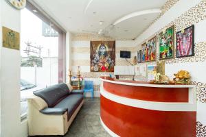 a salon with a red and white counter in a room at Rameswaram Amman Residency - Your Budjet-Friendly Stay in Rāmeswaram