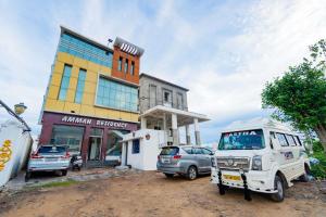 a car parked in front of a building at Hotel Amman Residency in Rāmeswaram
