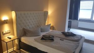 Postel nebo postele na pokoji v ubytování VALHALLA'S Hütte