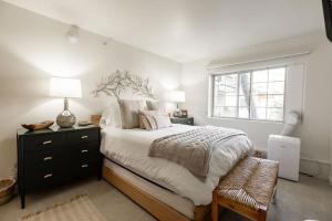 a bedroom with a large bed and a window at Condo with Onsite Pool & Hot Tub, Free WiFi & Garage Parking in Vail
