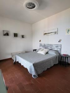A bed or beds in a room at Appartamenti Vanacore