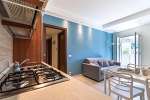 Η κουζίνα ή μικρή κουζίνα στο Stupendo Trilocale [Posto Auto Gratuito - WiFi & Netflix]