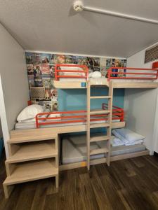 a room with two bunk beds in a room at hotelF1 Moret Fontainebleau in Moret-sur-Loing