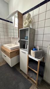 a small bathroom with a sink and a counter at Ferienwohnung Casa Claudia in Liezen