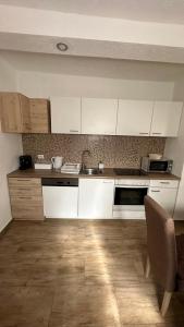 Kuchyň nebo kuchyňský kout v ubytování Ferienwohnung Casa Claudia