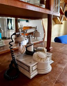 an old fashioned phone sitting on a table at Hotel Bashinjaghyan in Sevan