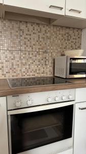 Kuchyň nebo kuchyňský kout v ubytování Ferienwohnung Casa Claudia