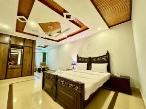 מיטה או מיטות בחדר ב-Atlas Residency