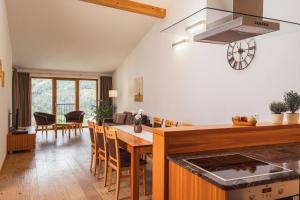 a kitchen and dining room with a table and chairs at Huberhof in Natz-Schabs