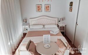Postel nebo postele na pokoji v ubytování B&B Greco Home