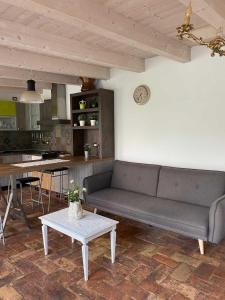 a living room with a couch and a table at Il Borghetto in Pesaro