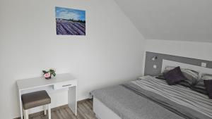 Postel nebo postele na pokoji v ubytování Apartment Andrea