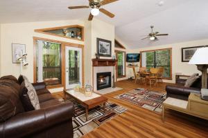 a living room with a couch and a fireplace at The Bird Hallar in Gatlinburg