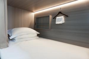 Letto o letti in una camera di Yunbo Youth Hostel Ürümqi