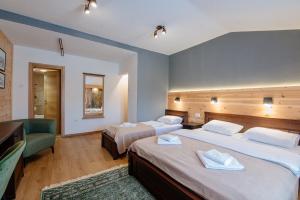 Postel nebo postele na pokoji v ubytování Hotel Zlatni bor