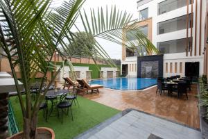 a courtyard with a swimming pool in a building at Grand Hotel Kathmandu in Kathmandu