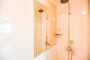 a bathroom with a shower with a mirror at Hotel Charlot Castle in Pyeongtaek