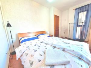 Postel nebo postele na pokoji v ubytování Apartment Olive Garden