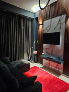 En TV eller et underholdningssystem på Vela Apartment