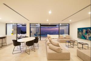a living room with a couch and a table at Villa Aqualeo in Adeje