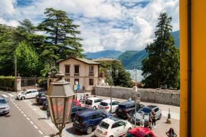a bunch of cars parked in a parking lot at Sandy - by MyHomeInComo in Cernobbio