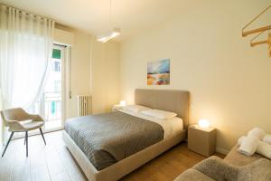 Ένα ή περισσότερα κρεβάτια σε δωμάτιο στο Domus Verona - Ampia residenza Filippini a pochi passi dall'Arena