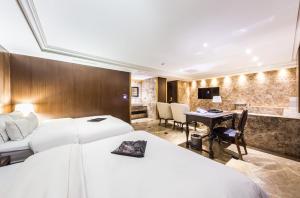 Letto o letti in una camera di Hotel Cullinan Wangsimni