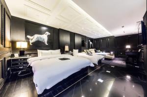 Letto o letti in una camera di Hotel Cullinan Wangsimni