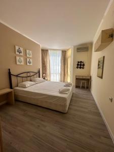 Ένα ή περισσότερα κρεβάτια σε δωμάτιο στο Complex Sands Holiday Apartments +133 φωτογραφίες