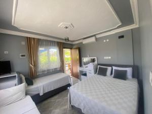 Кровать или кровати в номере Aspawa Hotel