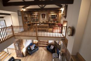 an overhead view of a living room with bookshelves at Hill Top Farm 22 in Bainbridge