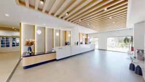 an office lobby with a reception desk at Sirios Village Hotel & Bungalows - All Inclusive in Kato Daratso +52 photos
