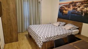 Apartments Pralas tesisinde bir odada yatak veya yataklar