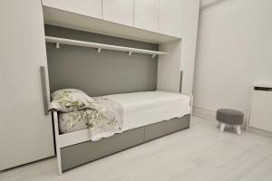 Postel nebo postele na pokoji v ubytování Attico di Piazza Cima