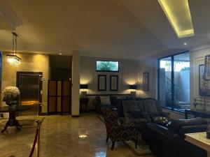 a living room with a couch and a table at Andaluz Boutique Hotel in Durban