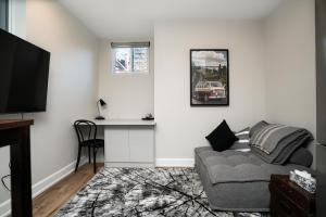 a living room with a couch and a table at Capital Apartments in Ottawa