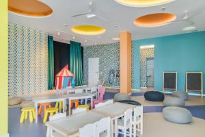 Uma TV ou centro de entretenimento em Pestana Blue Alvor Beach - All Inclusive Hotel