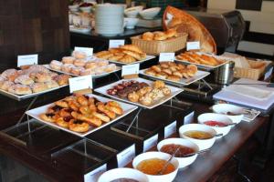 a buffet of pastries and other pastries on display at Hotel Peridot in New Delhi