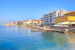 a view of a river in a city with buildings at Apartma Mariella in Piran