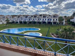 a view from the balcony of a building with a swimming pool at Casa Leonardo Luxury Esury in Ayamonte
