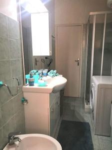 a bathroom with a sink and a toilet at Lo Scorcio sul porto in Porto Santo Stefano +18 photos