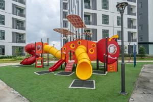 a playground with a slide in front of a building at [Cats Design Studio] #Level 27 #Austin #New condo in Johor Bahru