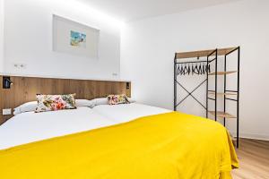 Postel nebo postele na pokoji v ubytování Hostal Paris